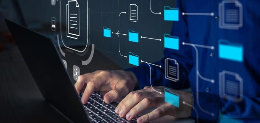 A person types on a laptop, surrounded by digital icons representing documents and file management systems.