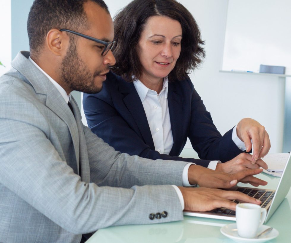 Man and woman working together at a laptop