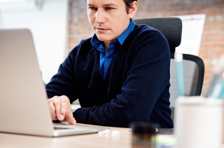 Man working on a laptop at a desk