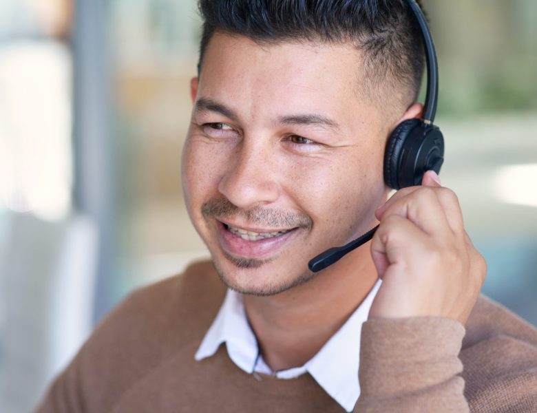 Smiling man wearing a headset